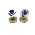 Blue artificial rose with gliter in a glass bell